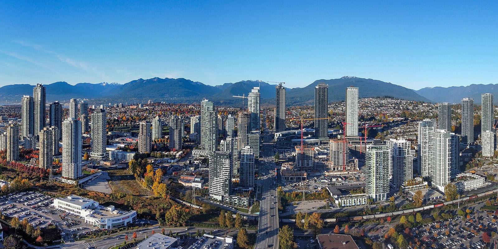 Brentwood's towers with the North Shore mountains behind — North Burnaby from the air